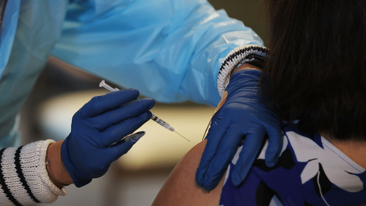 A healthcare worker administers a Pfizer-BioNtech Covid-19 vaccine. Credit: AFP File Photo