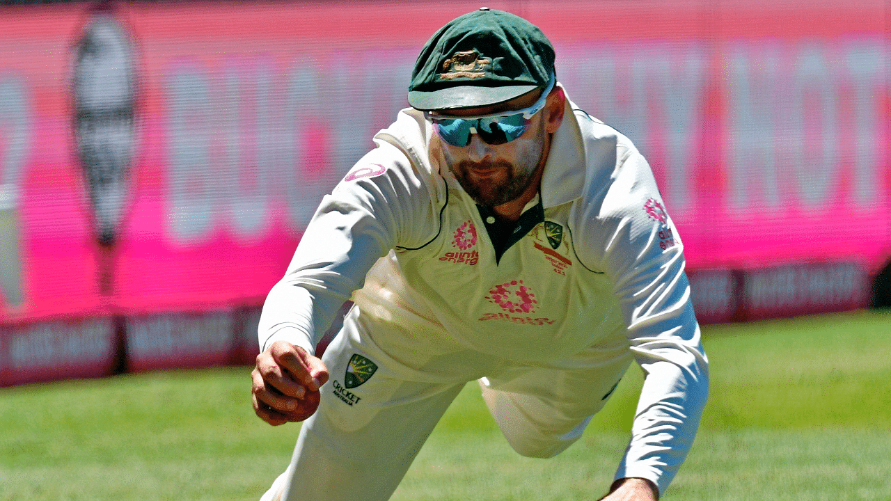 Australia's Nathan Lyon dives to stop the ball on the third day of the third cricket Test match between Australia and India at the Sydney Cricket Ground (SCG) in Sydney. Credit: AFP File Photo