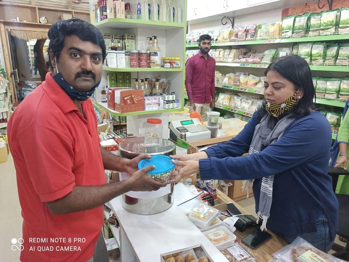 Kannada film actor-writer Vijay Chendoor picks up organic ellu bella from a store in Yelehanka.