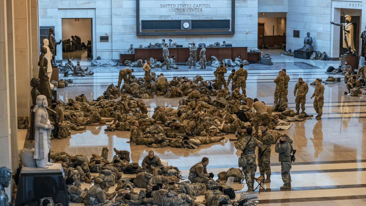 Hundreds of National Guard troops hold inside the Capitol Visitor's Center to reinforce security at the Capitol in Washington. Credit: AP Photo