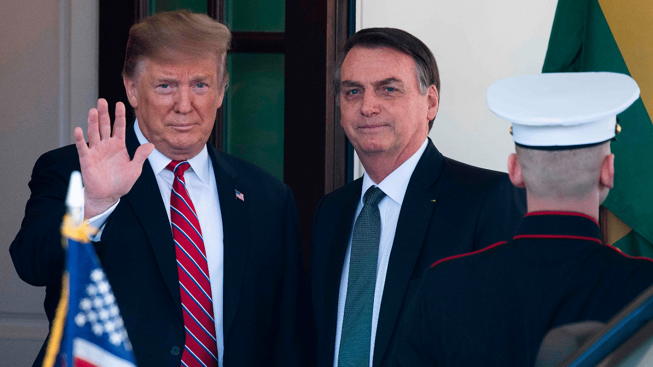 US President Donald Trump (L) waves as he welcomes Brazilian President Jair Bolsonaro to the White House in Washington, DC. Credit: AFP File Photo