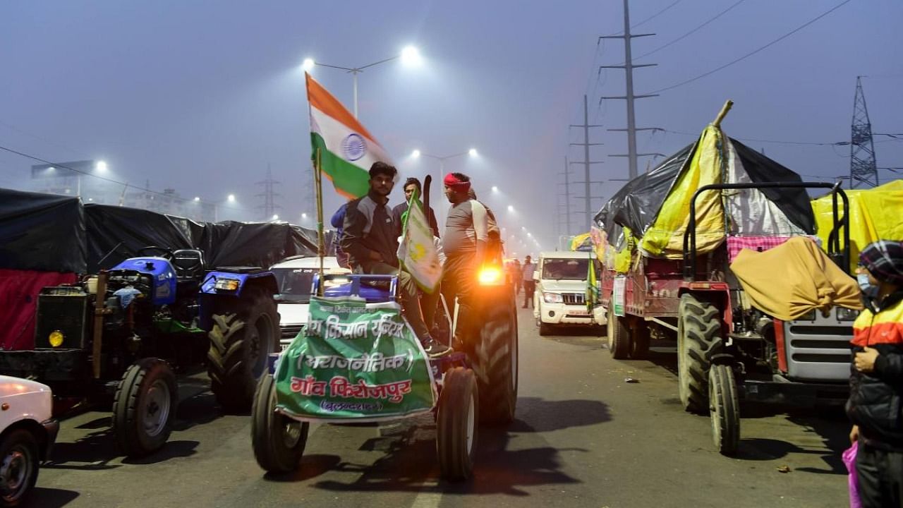 Farmers stage a protest against Centre's farm reform laws at Ghazipur border in New Delhi. Credit: PTI Photo