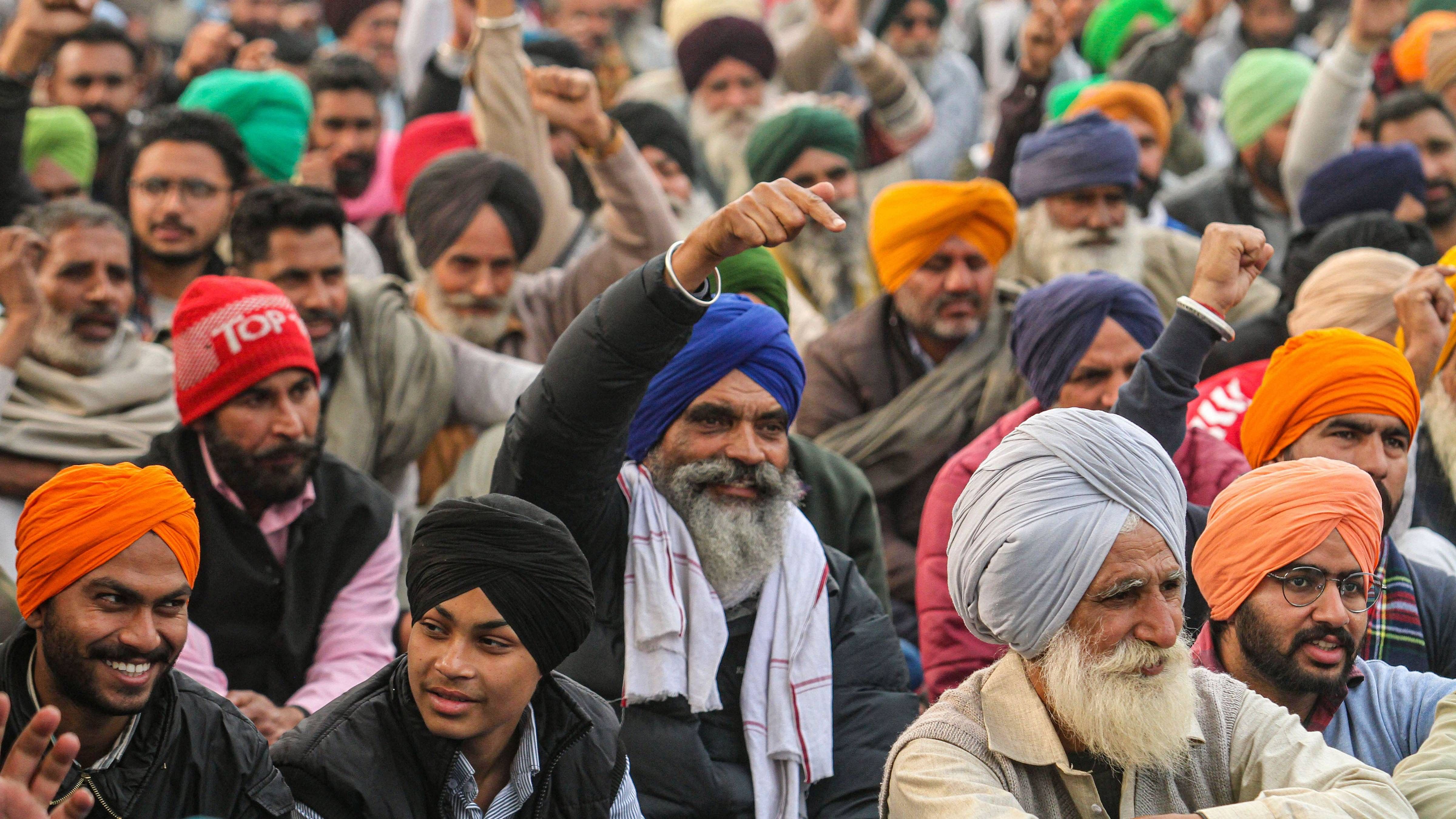 Farmers during their ongoing protest against the new farm laws, at Tikri border in New Delhi. Credit: PTI