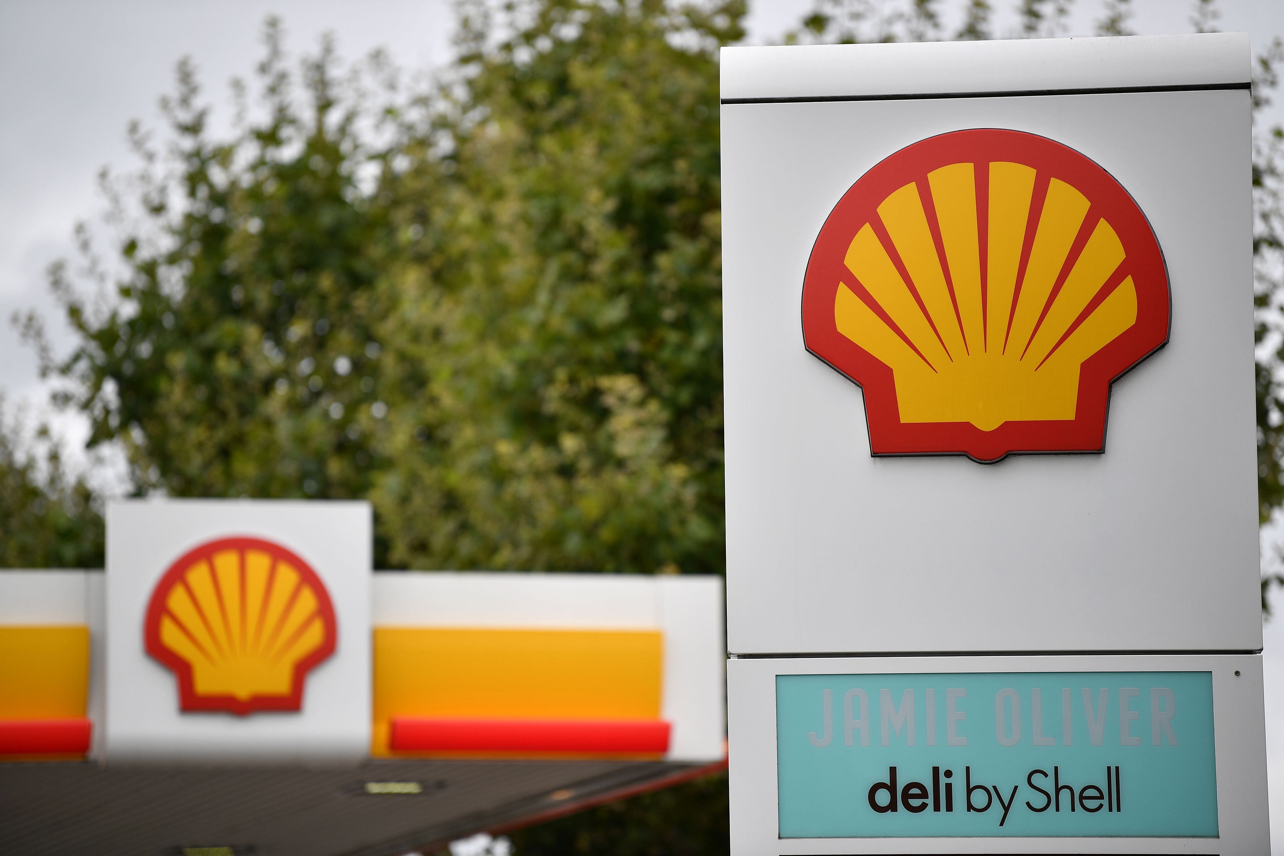 Logos are pictured at a Shell petrol station in Etlham. Credit: AFP Photo