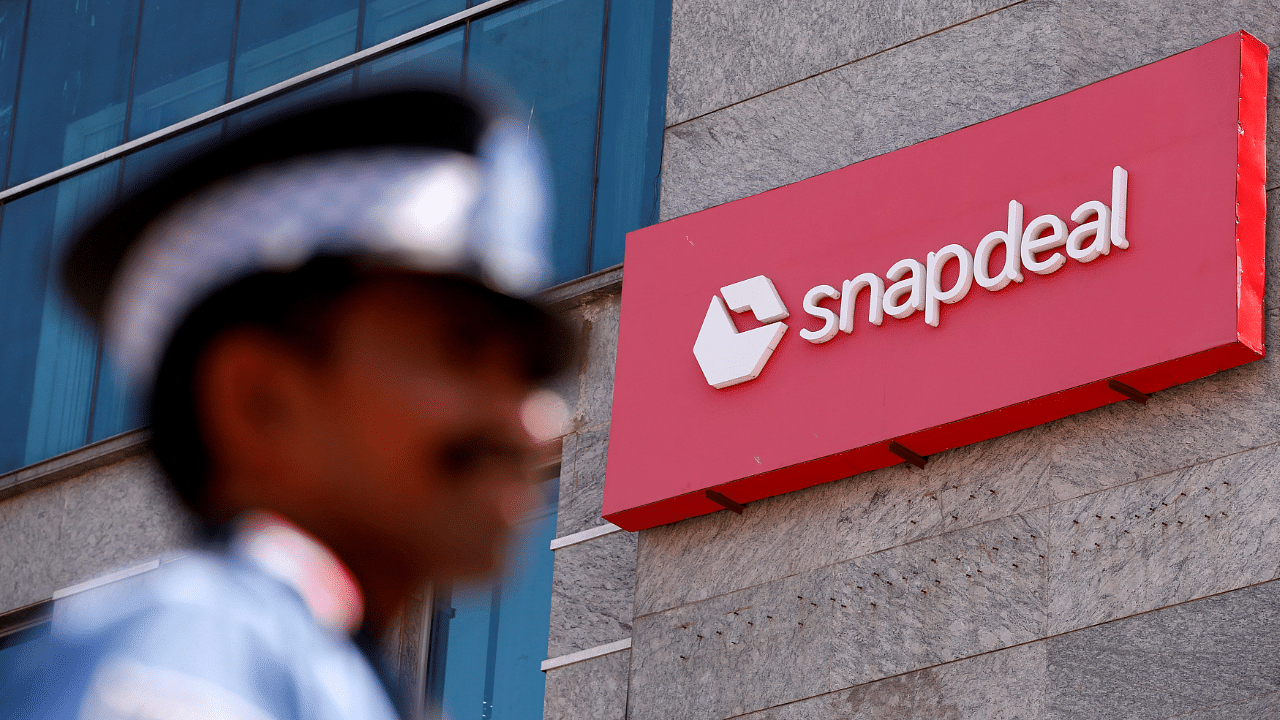 A private security gurad stands at a gate of Snapdeal headquarters in Gurugram. Credit: Reuters Photo