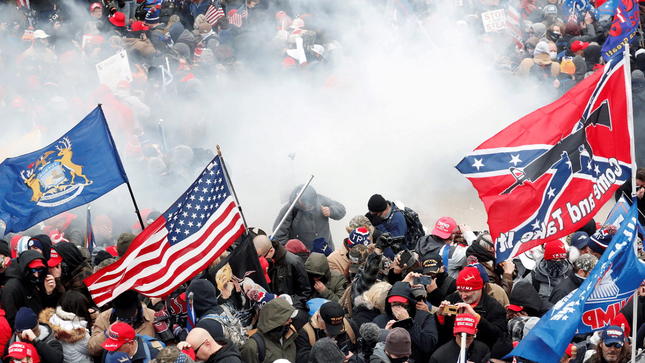 Supporters of Donald trump being teargassed outside the US Capitol Building. Credit: Reuters File Photo