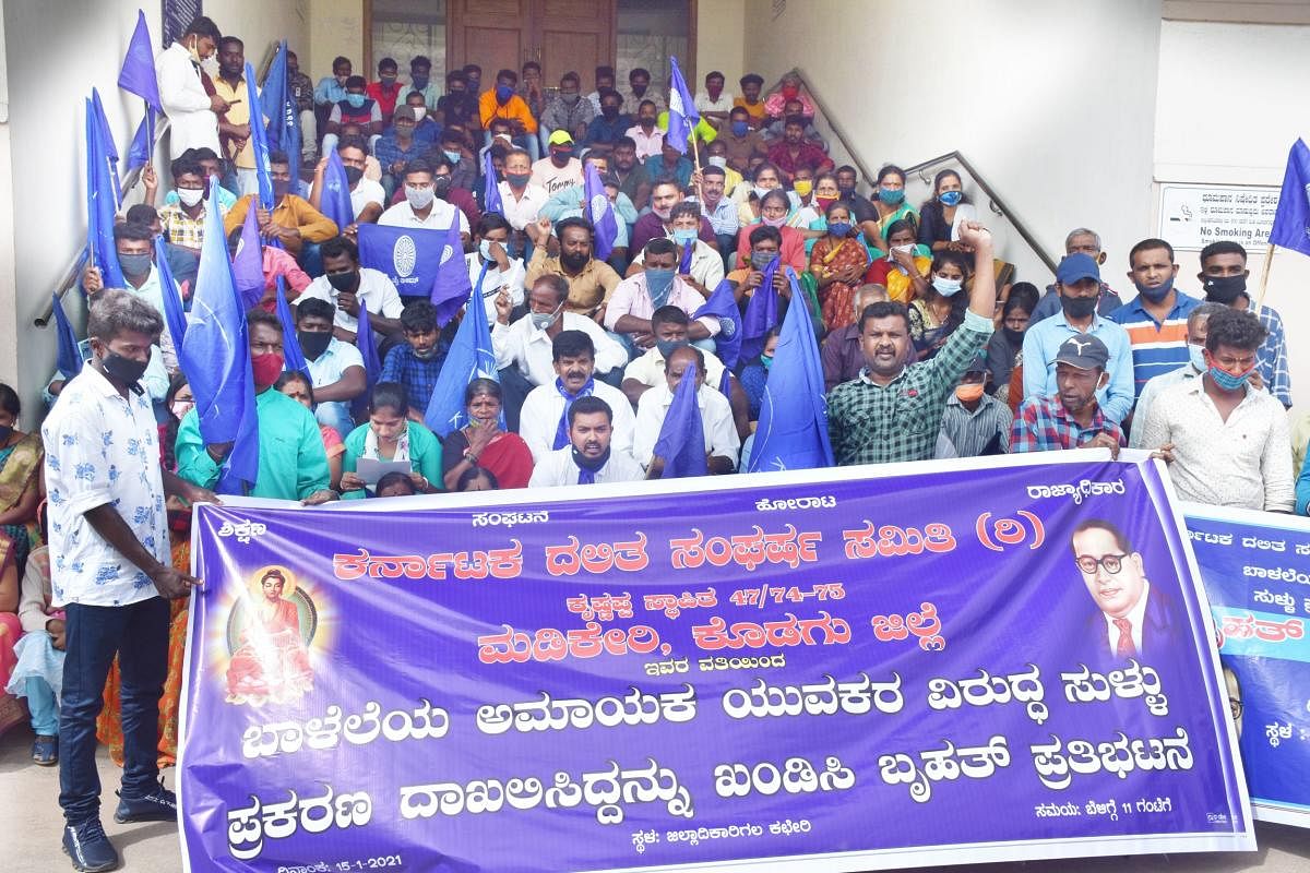 People stage a protest, under the aegis of Dalit Sangharsh Samiti, in front of the DC’s office in Madikeri on Friday. 