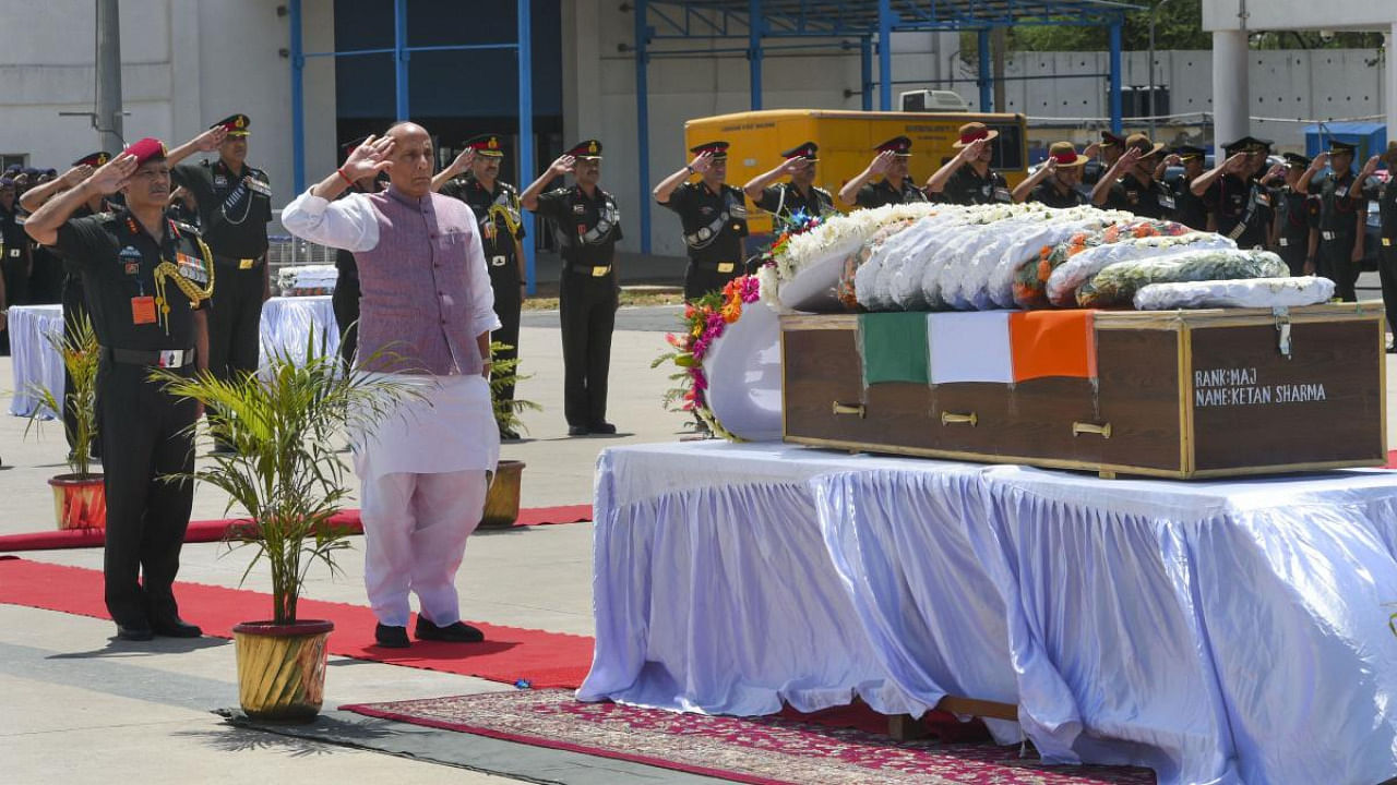Defence Minister Rajnath Singh pays tributes to Major Ketan Sharma after his mortal remains were brought at AFS Palam, in New Delhi. Credit: PTI file photo.