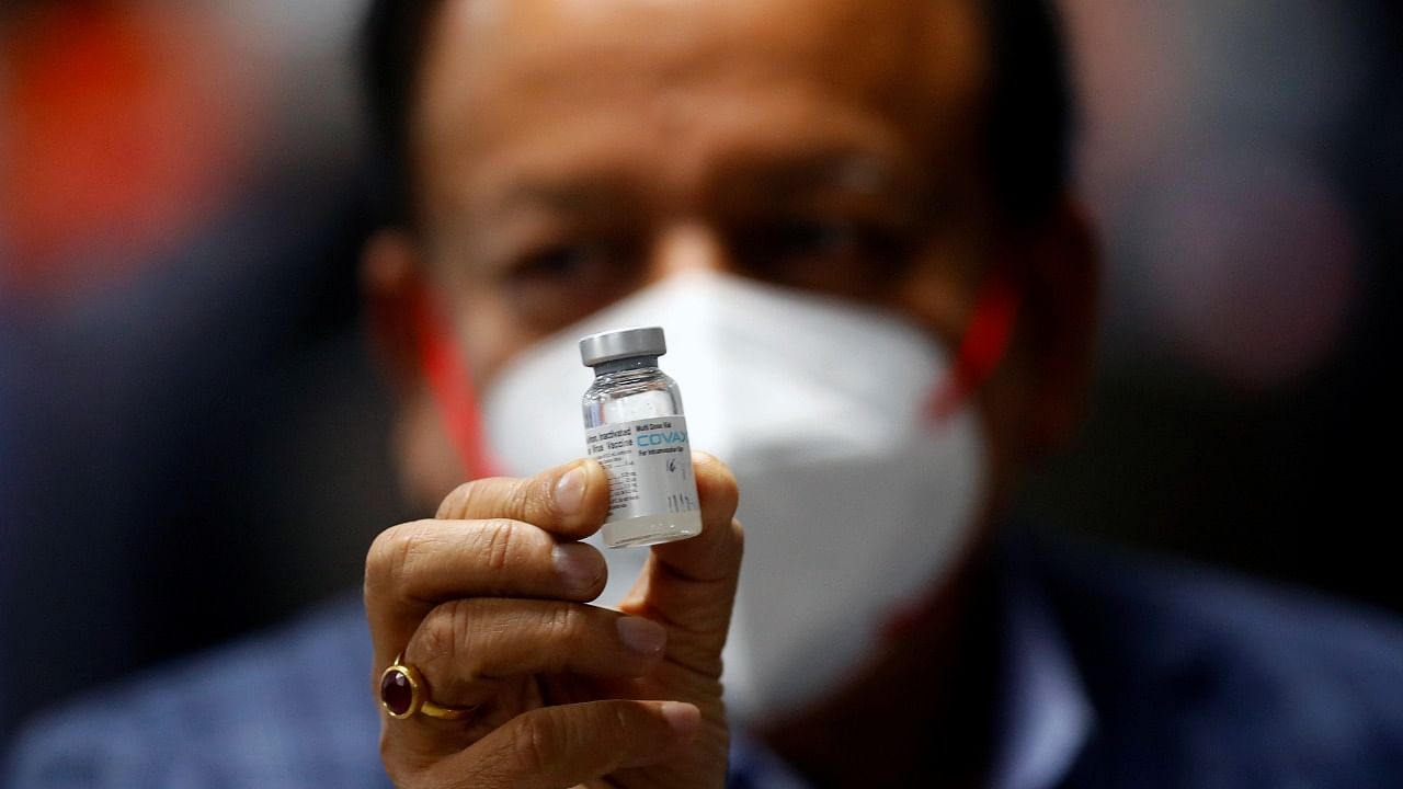 Health Minister Harsh Vardhan holds a dose of Bharat Biotech's Covid-19 vaccine called Covaxin. Credit: Reuters Photo