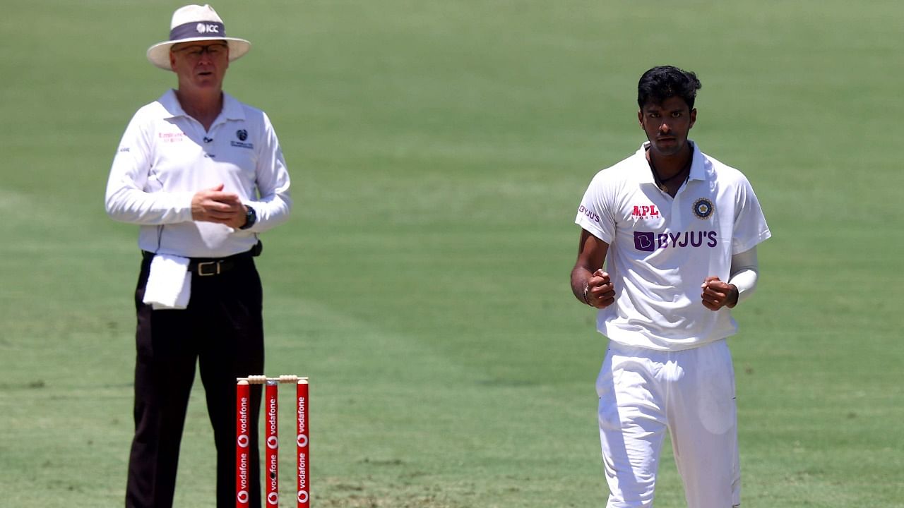 Washington Sundar celebrates taking the wicket of Australia's Cameron Green on day two of the fourth Test. Credit: AFP Photo