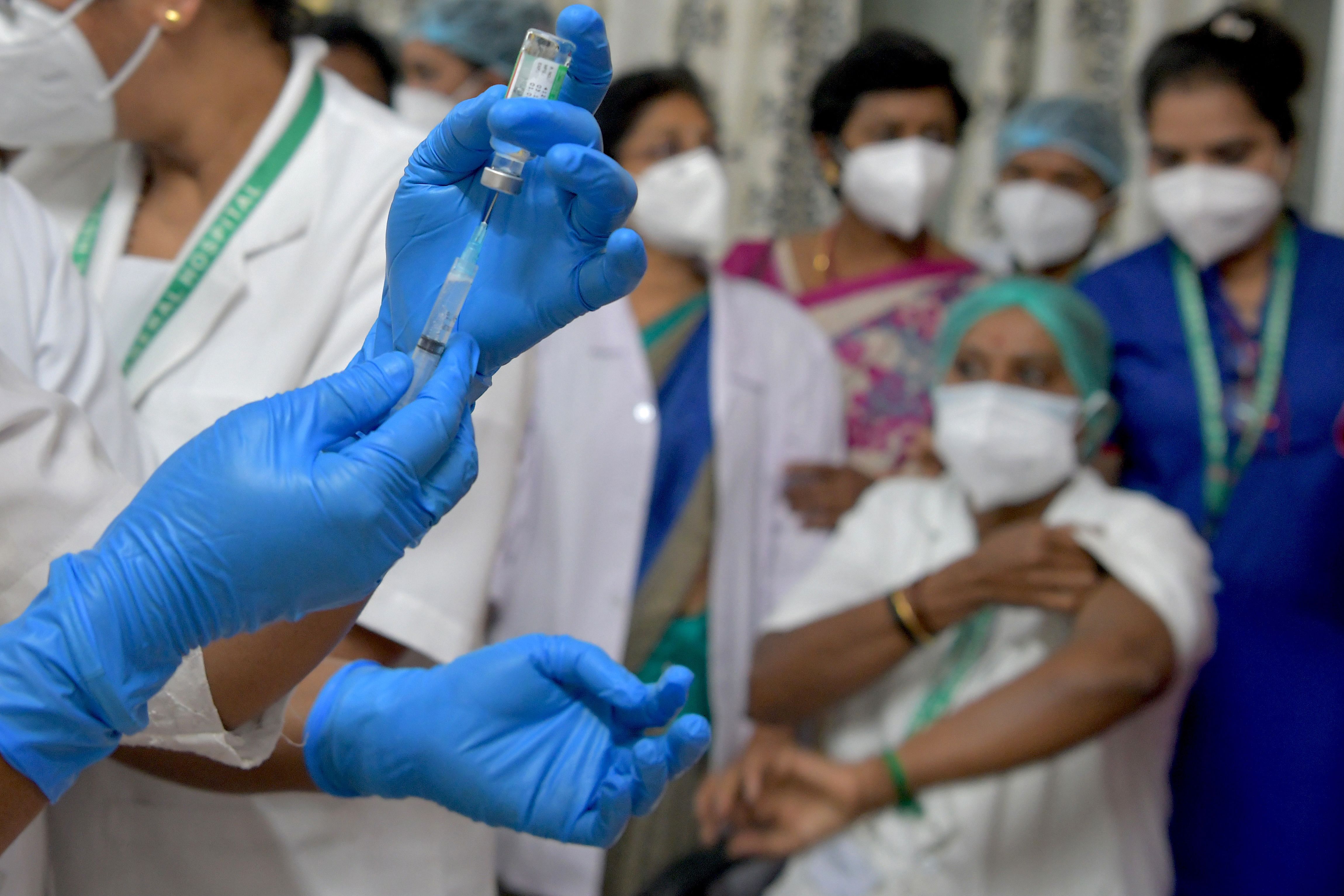 A nurse prepares to administer a Covid-19 coronavirus vaccine to health workers at the KC General hospital in Bangalore on January 16, 2021. Credit: AFP Photo