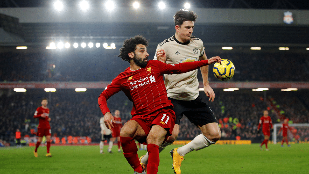Liverpool's Mohamed Salah in action with Manchester United's Harry Maguire the last time the two sides squared off at Anfield, Liverpool. Credit: Reuters File Photo