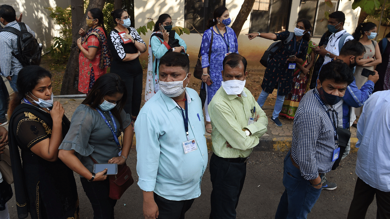 Health workers wait in line to receive a Covid-19 coronavirus vaccine at the Cooper hospital in Mumbai. Credit: AFP Photo
