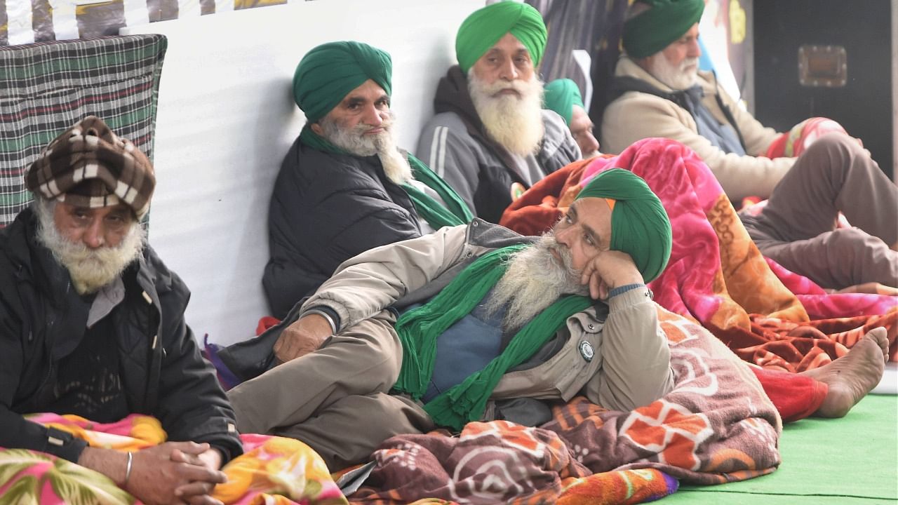 Farmers during their ongoing agitation over the new farm laws, at Singhu border in New Delhi. Credit: PTI Photo