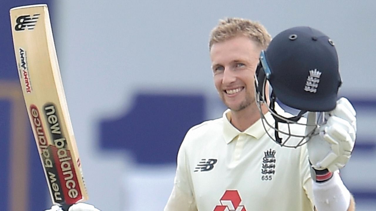 England captain Joe Root raises his bat after scoring 100 runs during the first test match between Sri Lanka and England at Galle International Cricket Stadium in Galle. Credit: PTI Photo