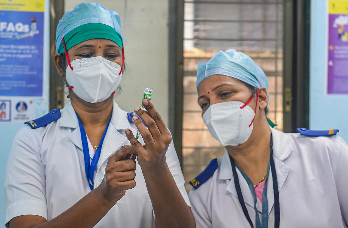 A nurse fills Covishield dose in an injection before administering to a frontline worker, after the virtual launch of COVID-19 vaccination drive by Prime Minister Narendra Modi, at Rajawadi hospital in Mumbai, Saturday, Jan. 16, 2021. Representative image/Credit: PTI Photo