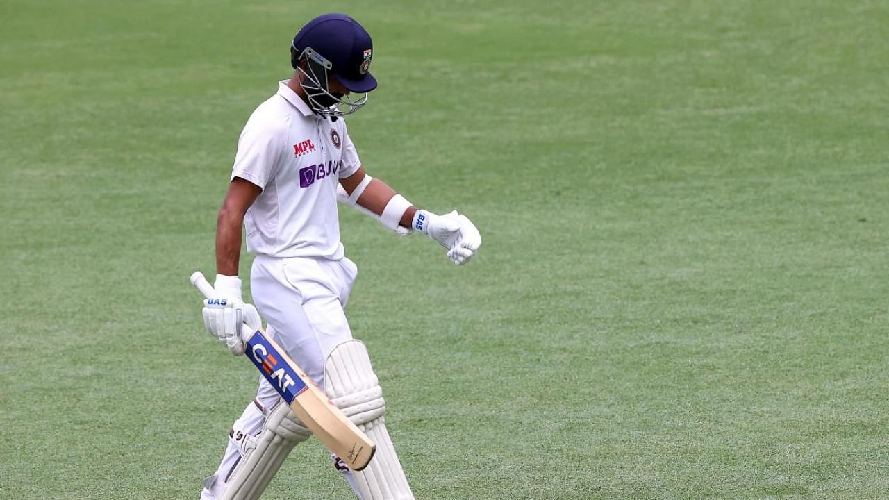Ajinkya Rahane departs after his dismissal on day three of the fourth cricket Test match between Australia and India at The Gabba in Brisbane. Credit: AFP.