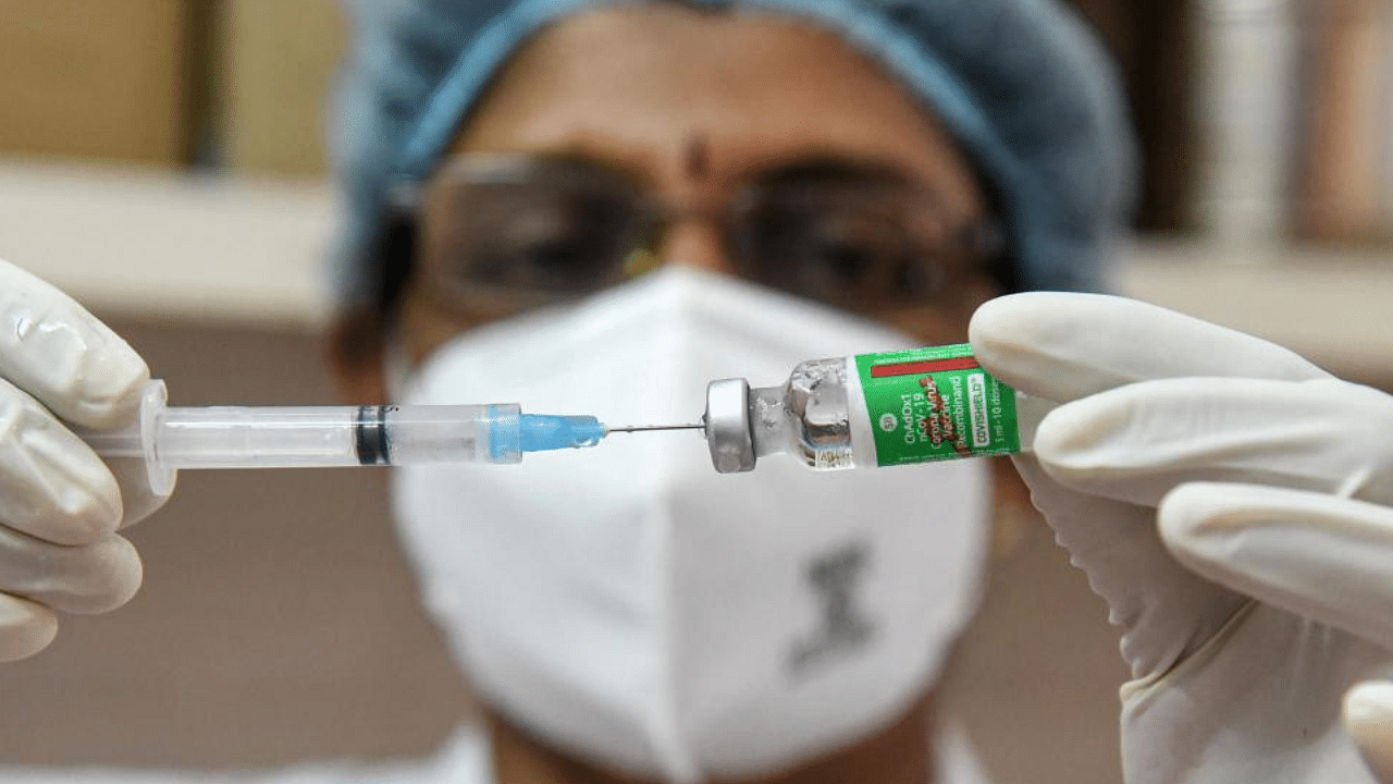 A medic prepares the dose of COVID-19 vaccine before giving it to a beneficiary, at Ernakulam Government General Hospital in Kochi, Saturday, Jan. 16, 2021. Credit: PTI Photo