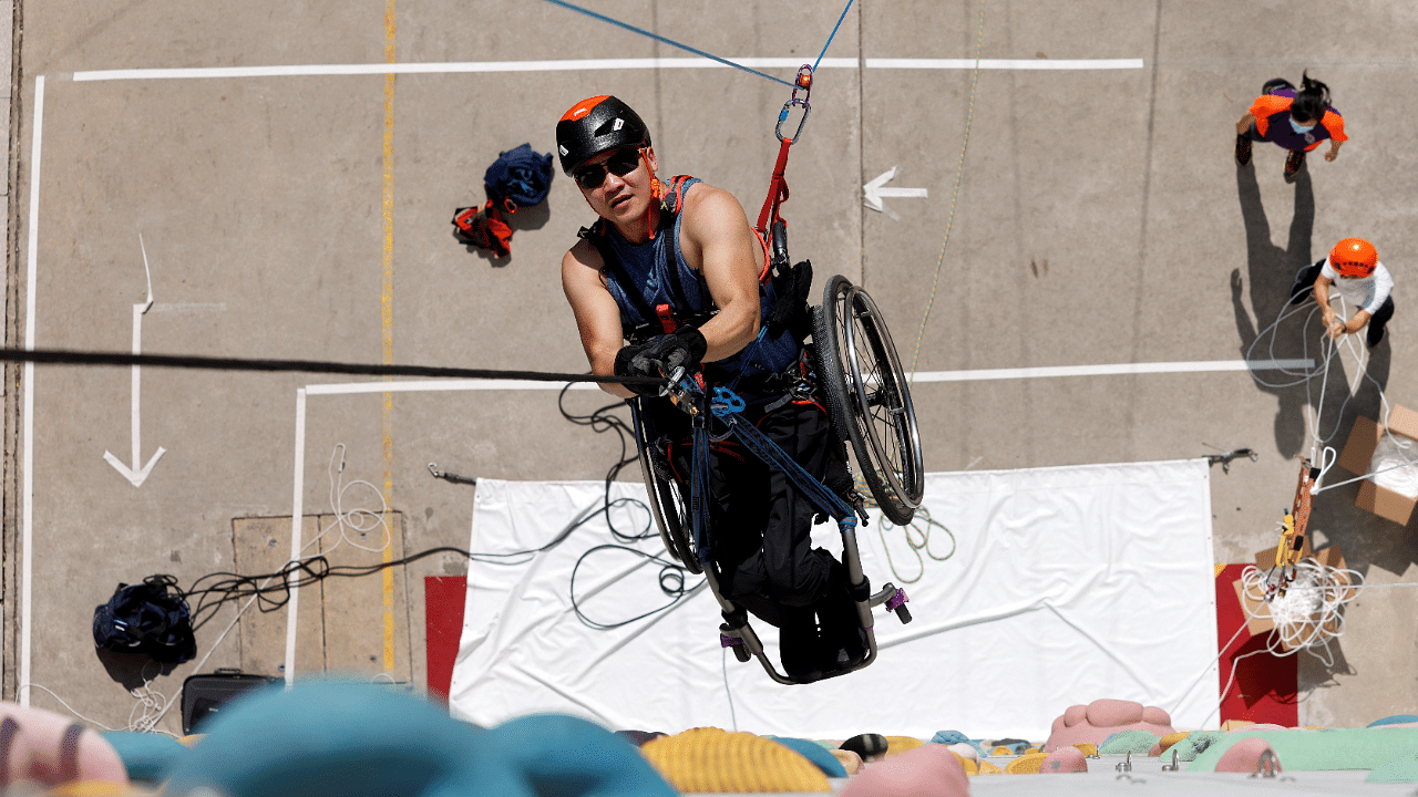 Lai Chi-wai, a paraplegic climber, attends a training session ahead of his attempt to climb the 320-metre tall Nina Tower using his upper body strength, in Hong Kong, China. Credit: Reuters Photo
