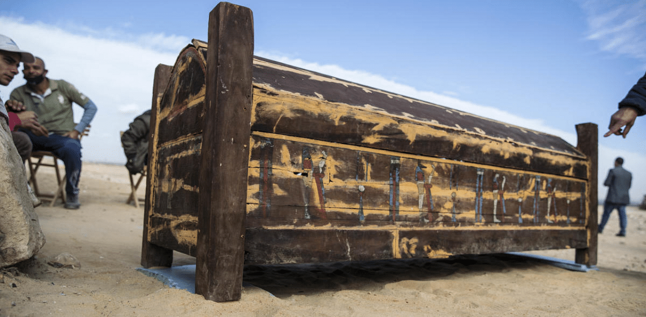 An adorned wooden sarcophagus is displayed during the official announcement of the discovery by an Egyptian archaeological mission of a new trove of treasures at Egypt's Saqqara. Credit: AFP Photo