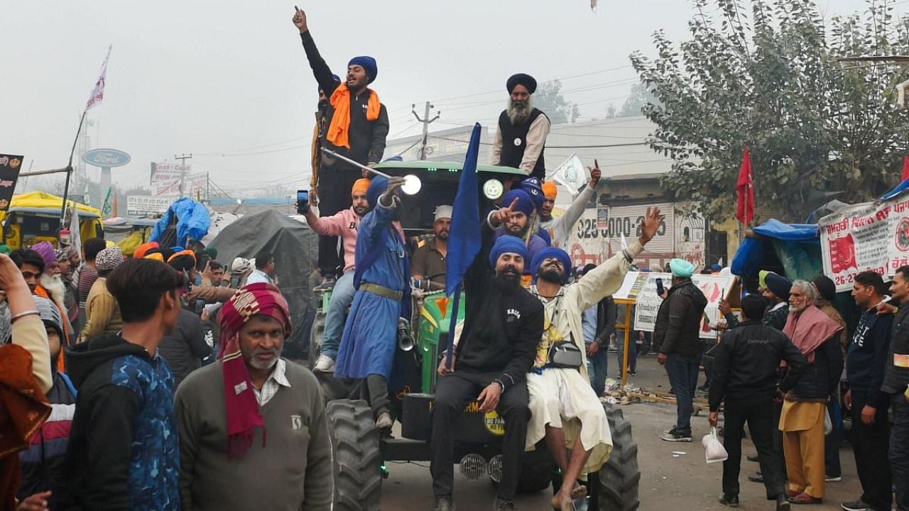 Nihangs' ride a tractor during farmers' ongoing agitation over the new farm laws, at Singhu border in New Delhi. Representative image. Credit: PTI/ Representative