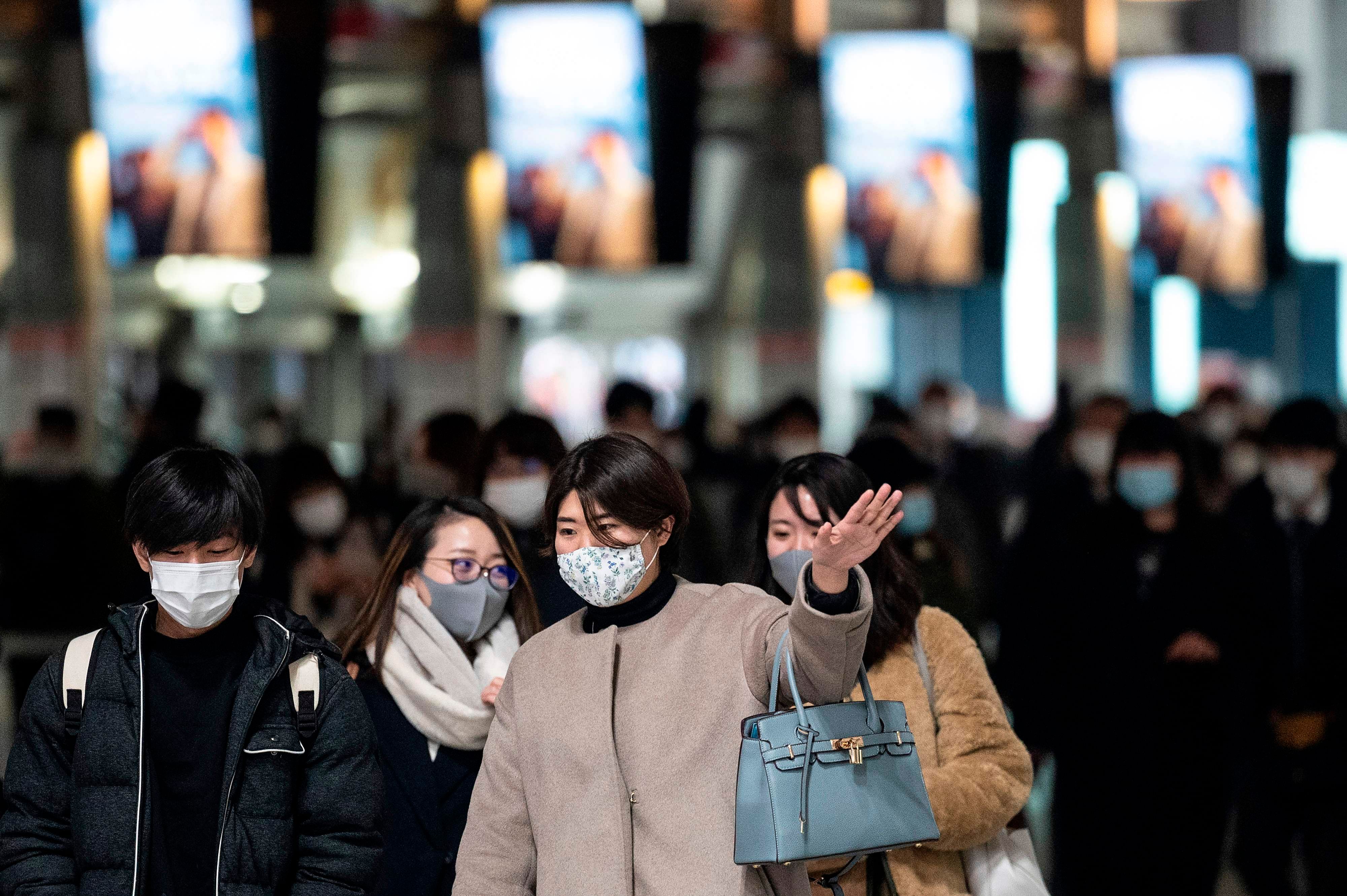 People walk at Shinagawa station in Tokyo. Credit: AFP Photo