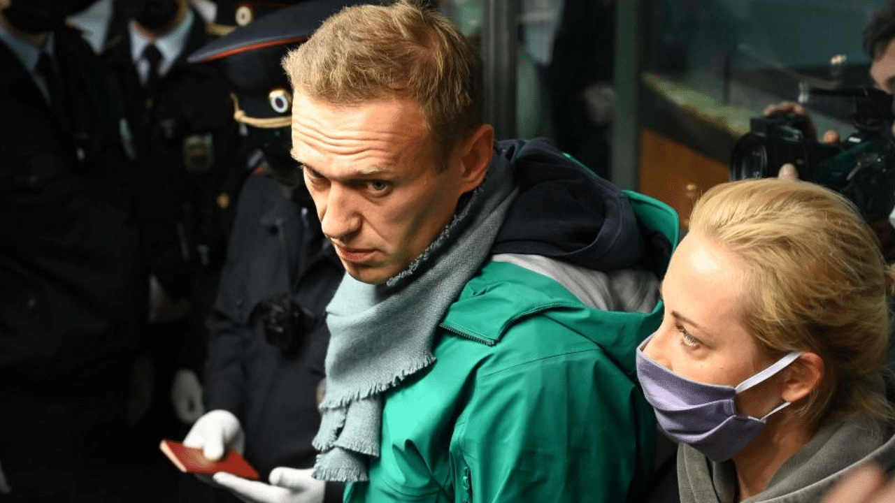 Russian opposition leader Alexei Navalny and his wife Yulia are seen at the passport control point at Moscow's Sheremetyevo airport on January 17, 2021. Credit: AFP Photo