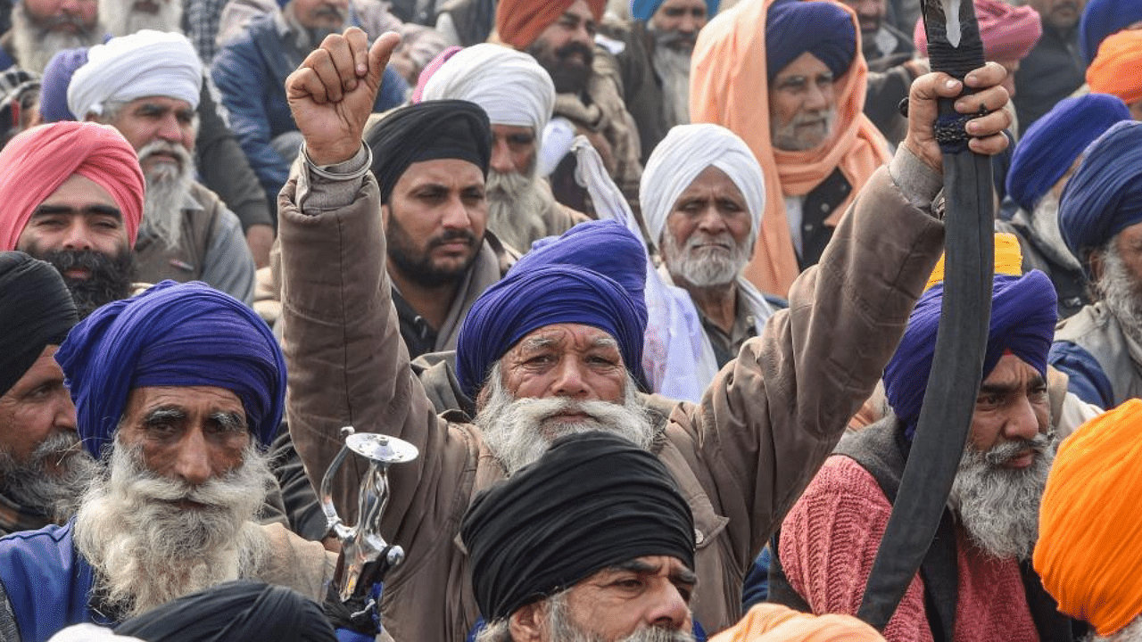 Farmers during their ongoing agitation over new farm reform laws, at Singhu border in New Delhi, Friday, Jan. 15, 2021.  Credit: PTI Photo