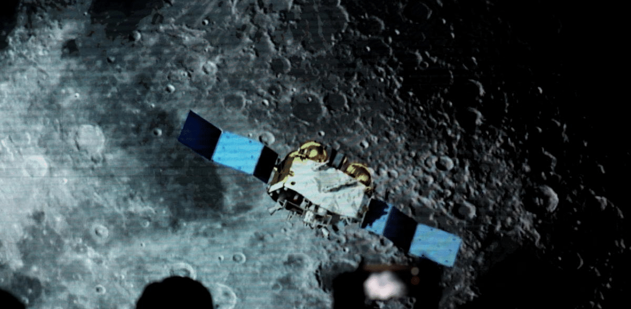 A screen shows footages of spacecraft for Chang'e-5 Mission, during an event on China’s lunar exploration program, at the National Astronomical Observatories of Chinese Academy of Sciences. Credit: Reuters Photo