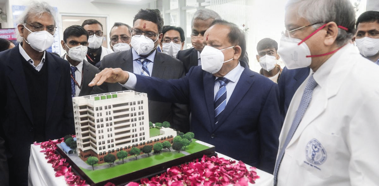 Union Minister for Health & Family Welfare Harsh Vardhan with AIIMS Director Randeep Guleria and other senior faculty members looks at a hospital model after inauguration and dedication of the new Burns & Plastic Surgery Block in the AIIMS. Credit: PTI Photo