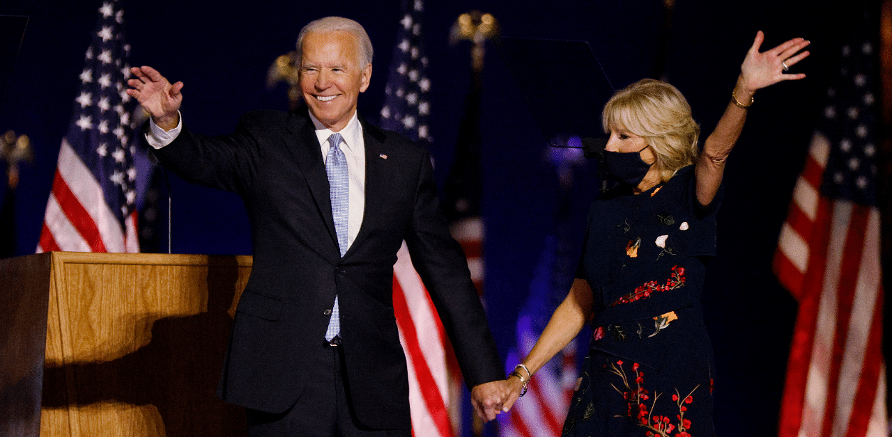 President-elect Joe Biden and his wife Jill wave to the crowd after speaking at his election rally. Credit: Reuters Photo