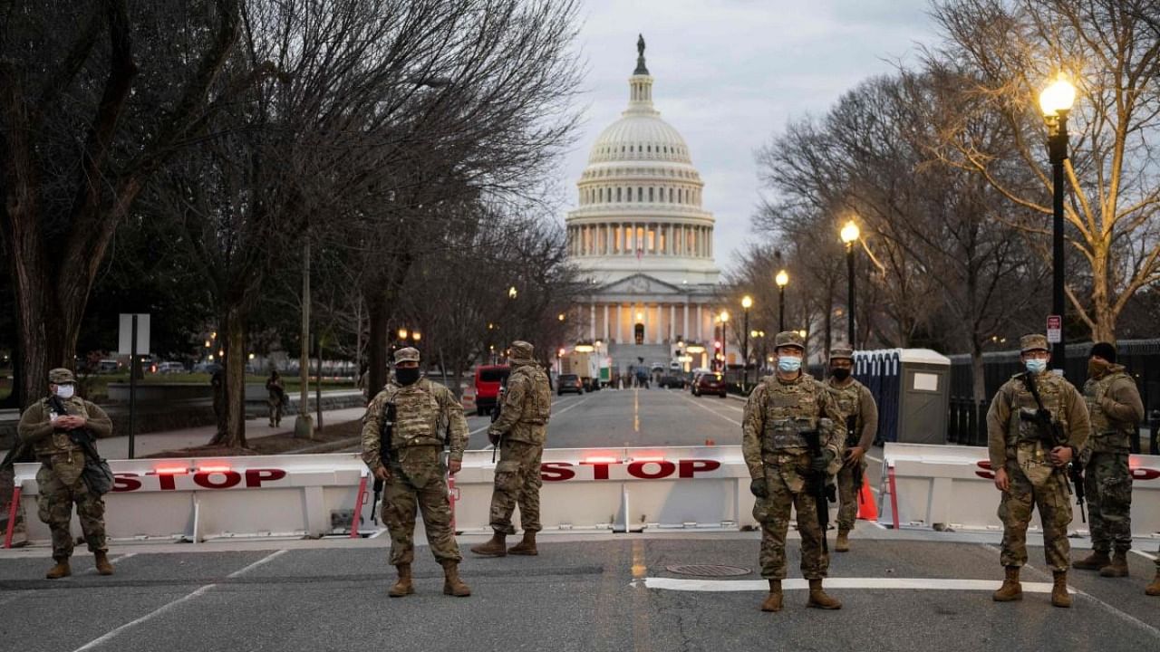 Members of the US National Guard stand watch at the US Capitol in Washington, DC on January 17, 2021, during a nationwide protest called by anti-government and far-right groups supporting US President Donald Trump and his claim of electoral fraud in the November 3 presidential election. Credit: AP/PTI.