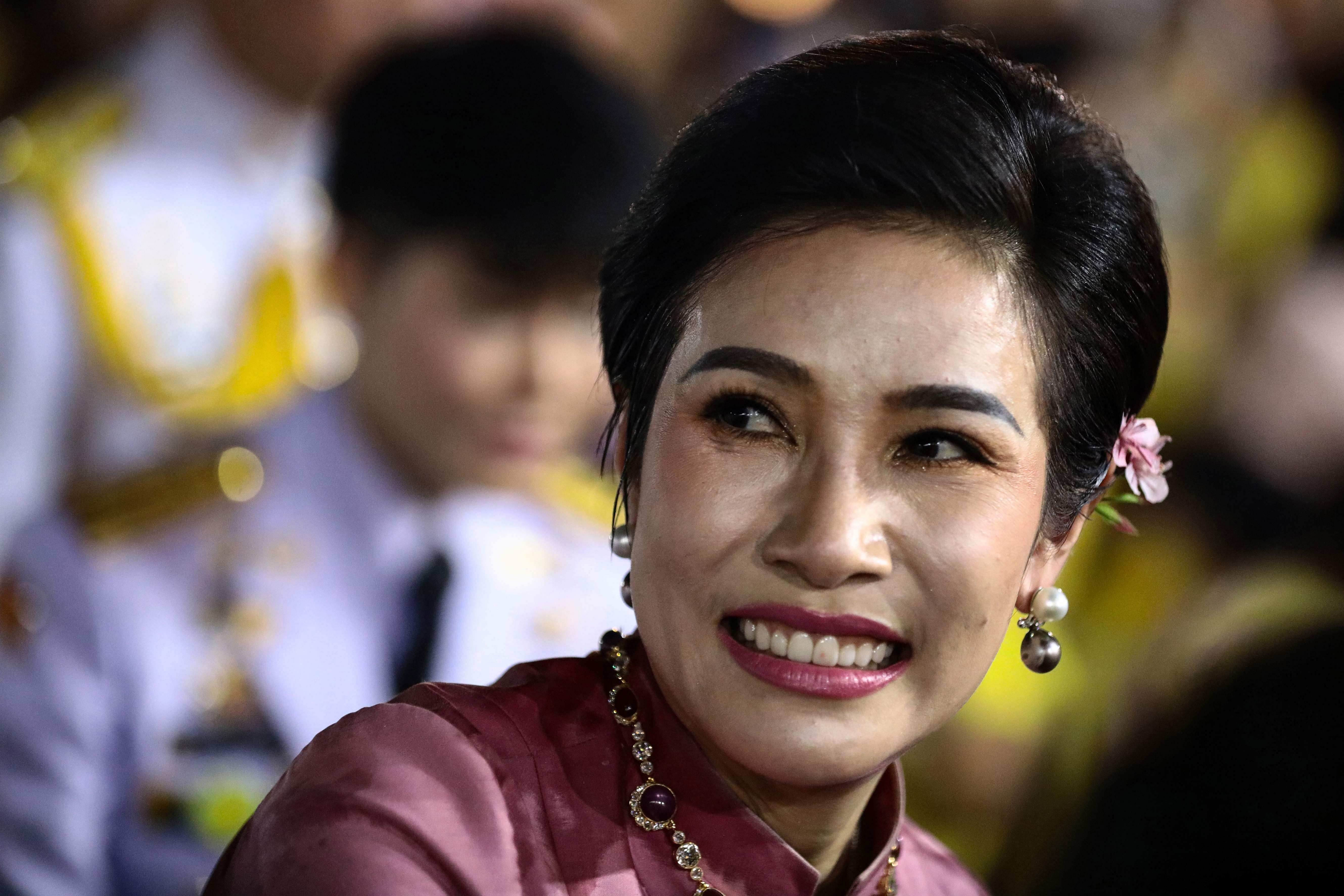Royal noble consort Sineenat Bilaskalayani, also known as Sineenat Wongvajirapakdi, smiles outside the Grand Palace in Bangkok. Credit: AFP File Photo