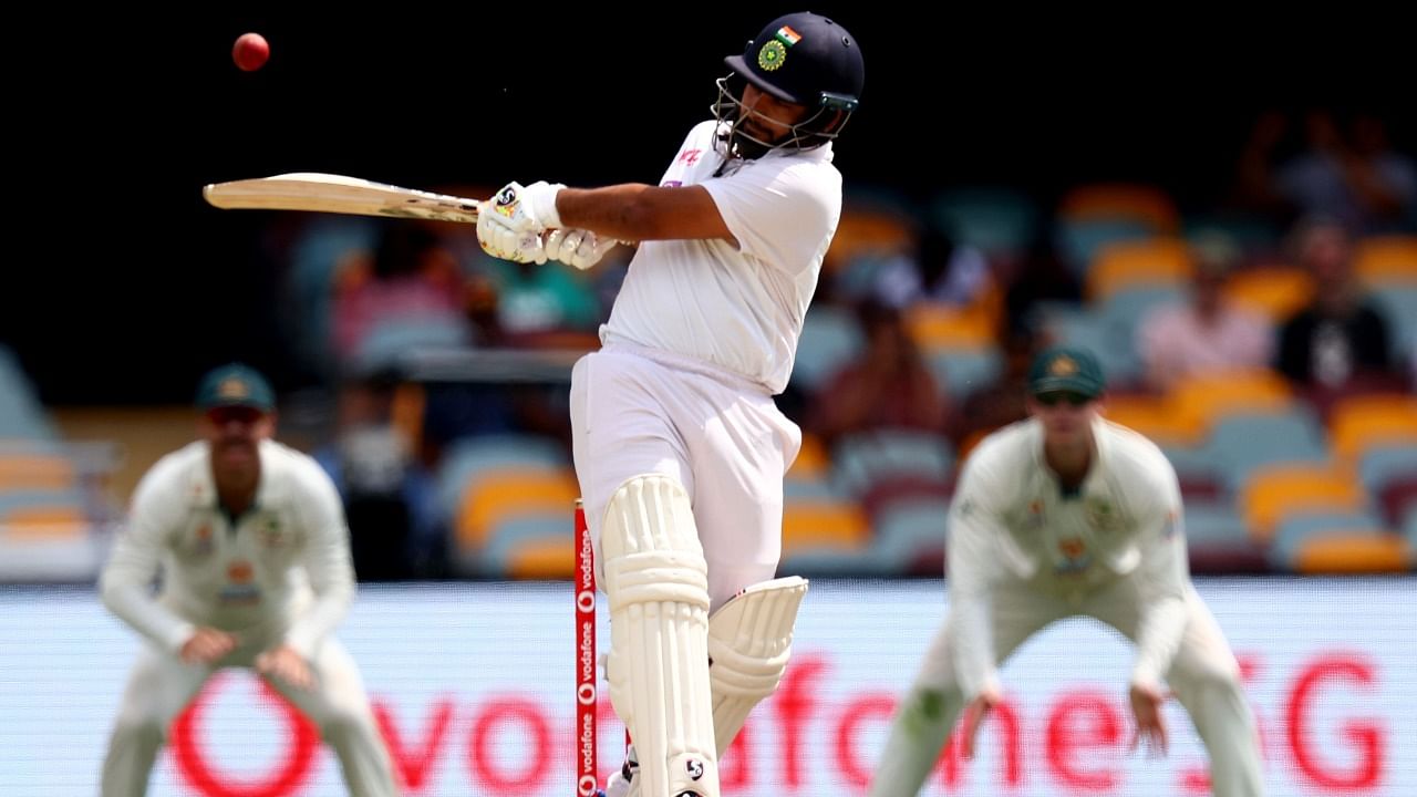 India's batsman Rishabh Pant plays a hook shot on day five of the fourth cricket Test match between Australia and India at The Gabba in Brisbane on January 19, 2021. Credit: AFP Photo