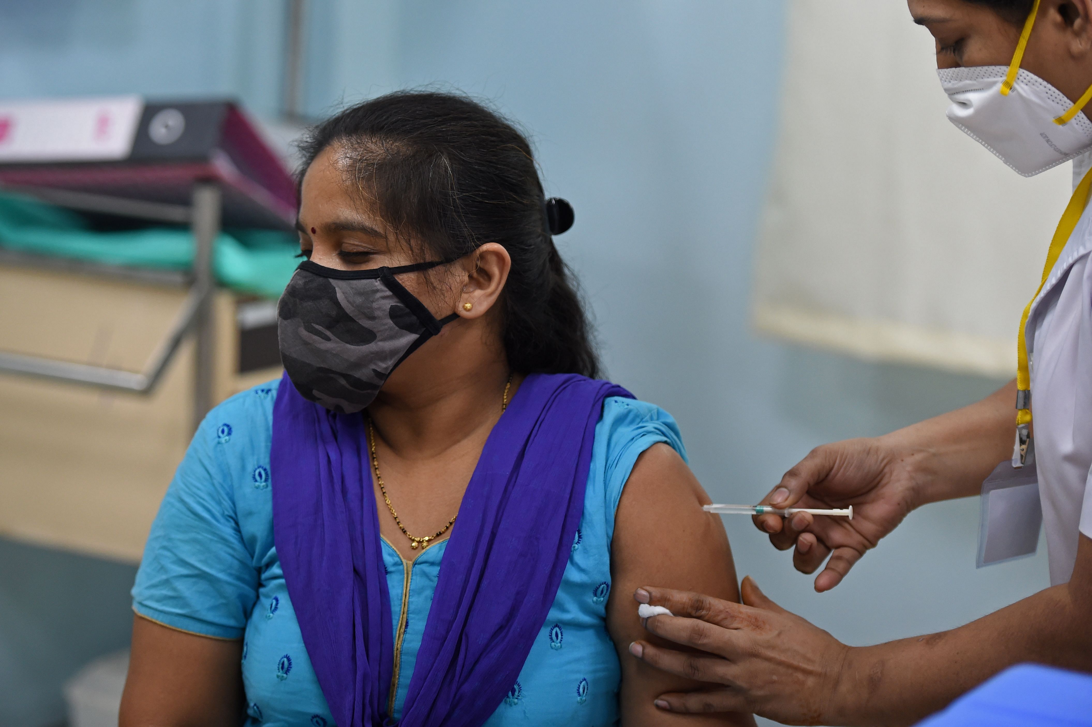 A medical worker inoculates a colleague with a Covid-19 coronavirus vaccine. Credit: AFP Photo