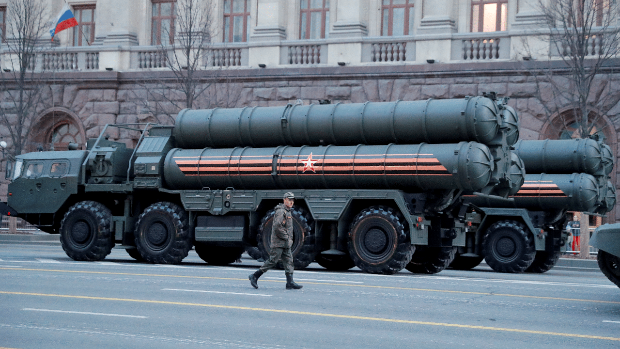 Russian serviceman walks past S-400 missile air defence systems. Credit: Reuters Photo