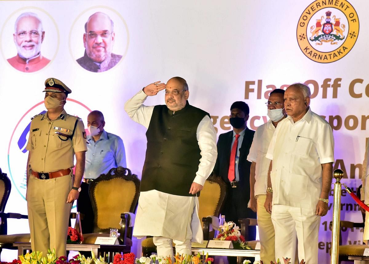Union Home Minister Amit Shah along with Karnataka Chief Minister B S Yediyurappa during the flagging off ceremony of the Emergency Spandana vehicles of Police Department. Credit: PTI