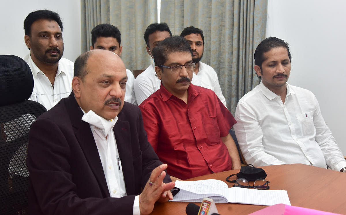 Karnataka Minority Commission chairman Abdul Azeem speaks to reporters at Circuit House in Kadri, Mangaluru, on Monday. Beary Sahitya Academy president Rahim Ucchil is also seen.