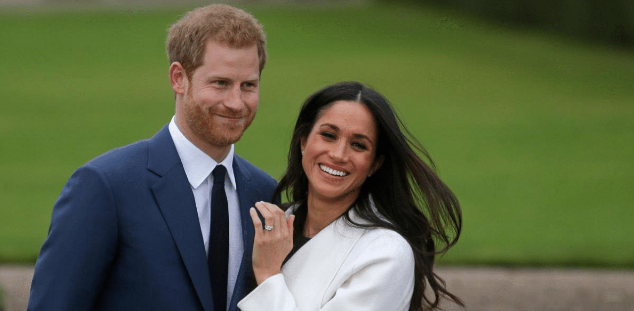 Britain's Prince Harry and his fiancée US actress Meghan Markle. Credit: AFP. 