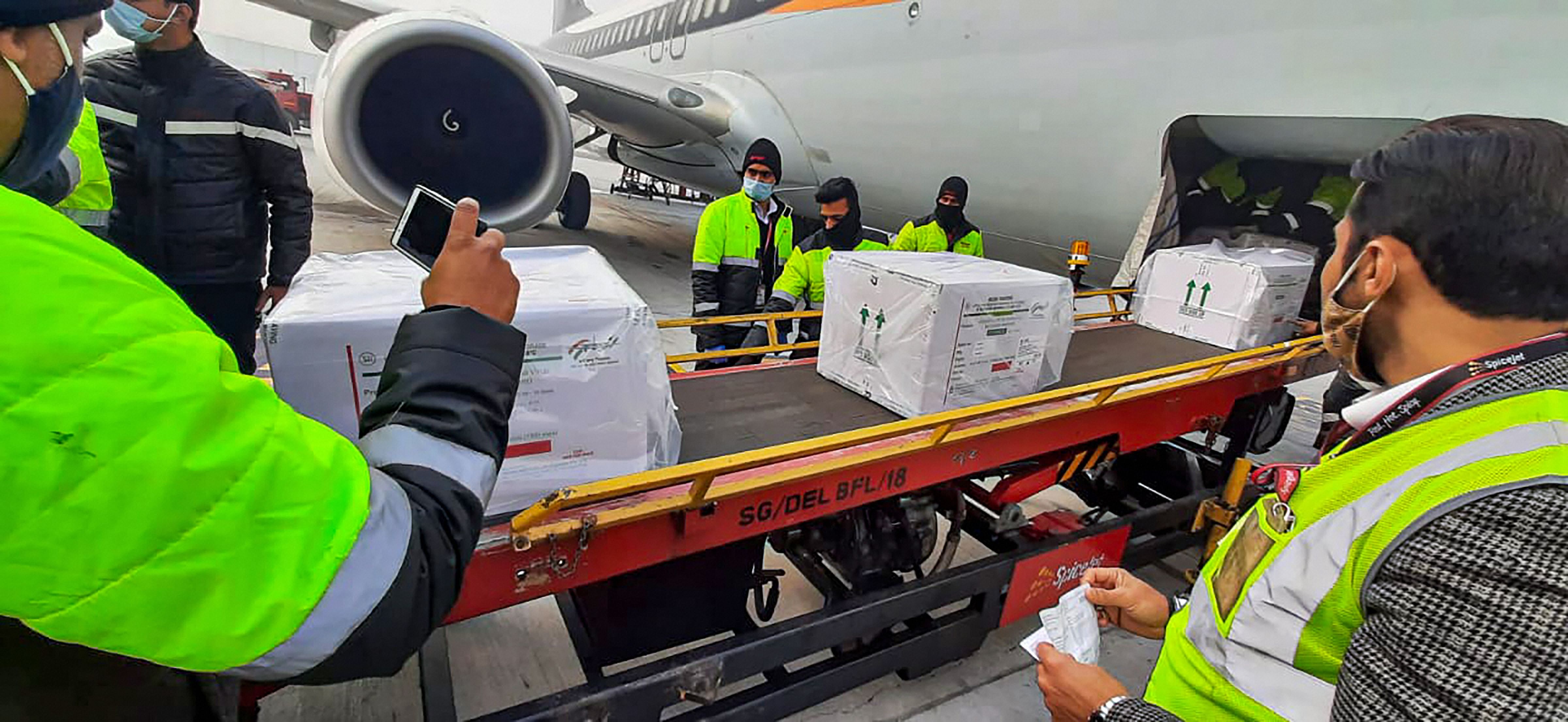 First consignment of Covid-19 vaccination arrives at Delhi Airport in a special SpiceJet flight from Pune. Credit: PTI Photo