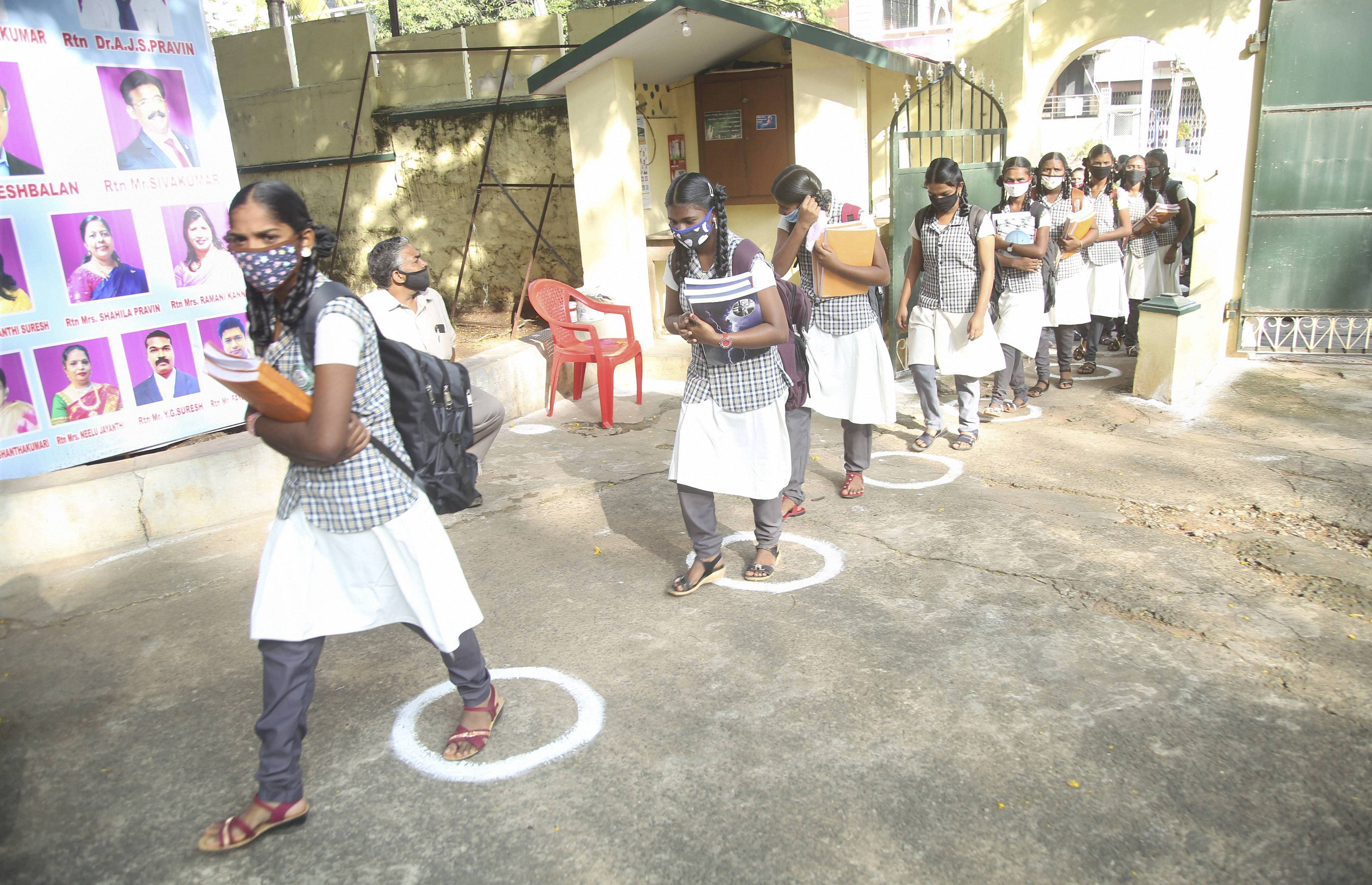 Students arrive to attend classes after schools reopened for 10 and 12 standard pupils, following allowance by authorities since its closure from March 19, 2019 due to coronavirus pandemic, in Kanyakumari, Tuesday, Jan. 19, 2021. Credit: PTI Photo