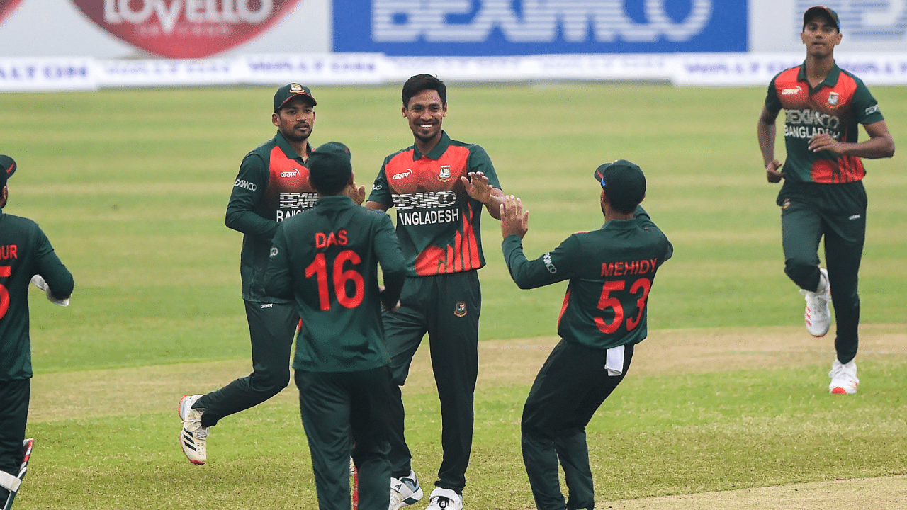 Bangladesh's Mustafizur Rahman (C) celebrates with teammates after dismissing West Indies' Sunil Ambris during the first one-day international (ODI) cricket match at the Sher-e-Bangla National Cricket Stadium in Dhaka. Credit: AFP Photo