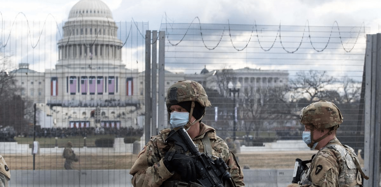 US National Guard troops patrol the vicinity of the US Capitol hours before the Inauguration of US President-Elect Joe Biden in Washington, DC. Credit: AFP Photo
