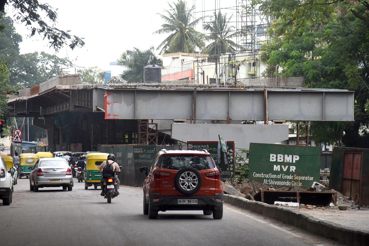 Work on the steel flyover at Sivananda Circle in Bengaluru has been going on at a snail's pace. DH PHOTO/S K DINESH