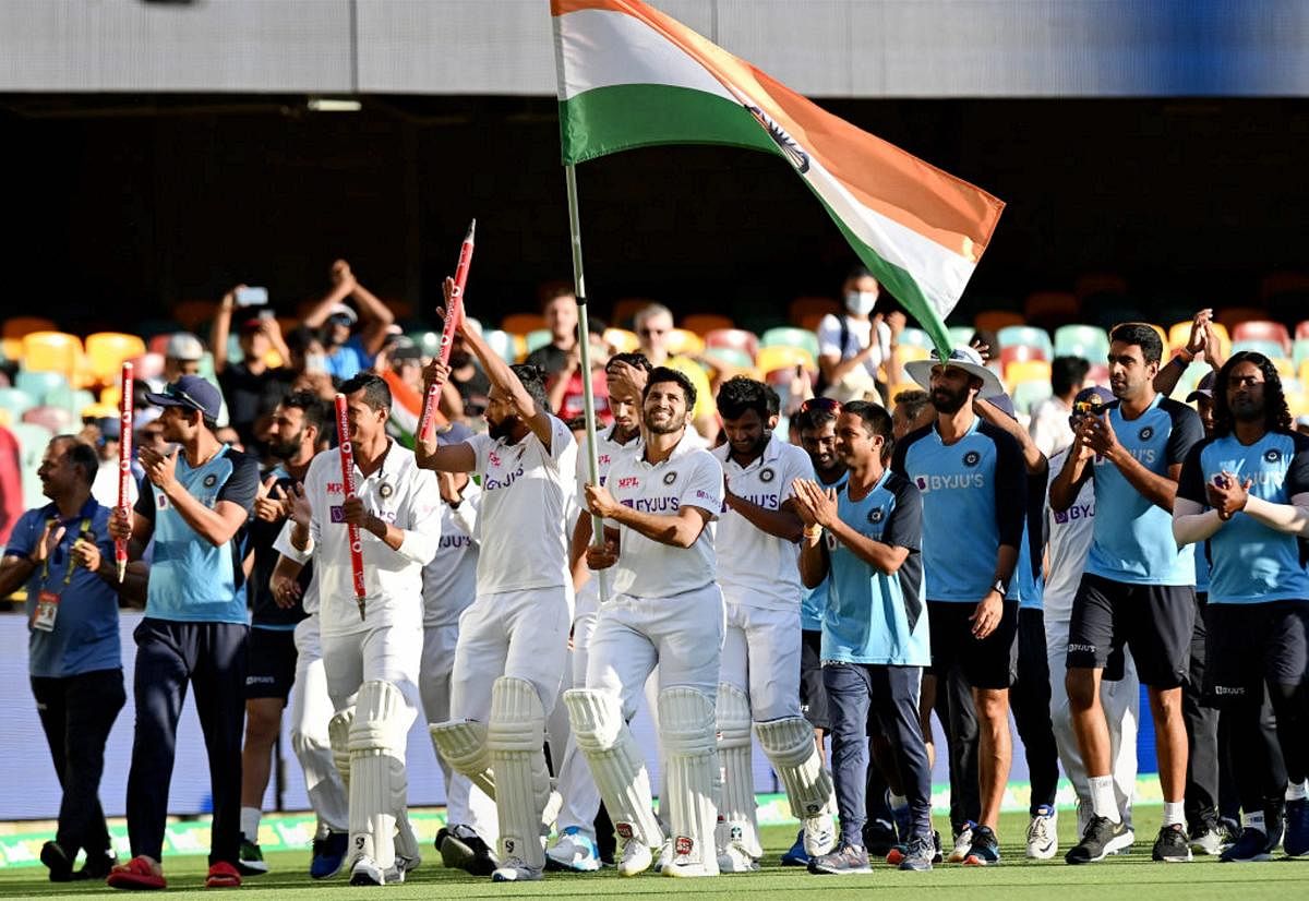Indian players celebrate after defeating Australia by three wickets on the final day of the fourth cricket test match at the Gabba, Brisbane, Australia, Tuesday, Jan. 19, 2021. Credit: PTI Photo