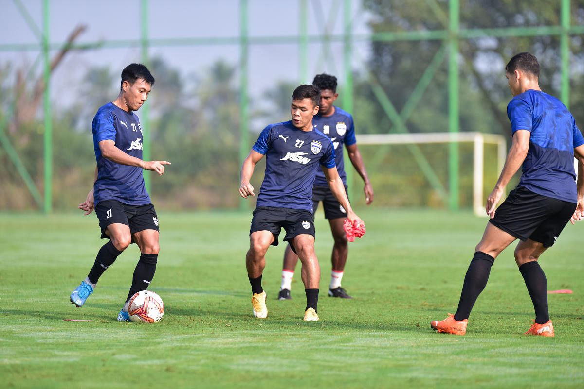 Bengaluru FC’s Udanta Singh (left) and Suresh Singh Wangjam during a training session on Tuesday. 