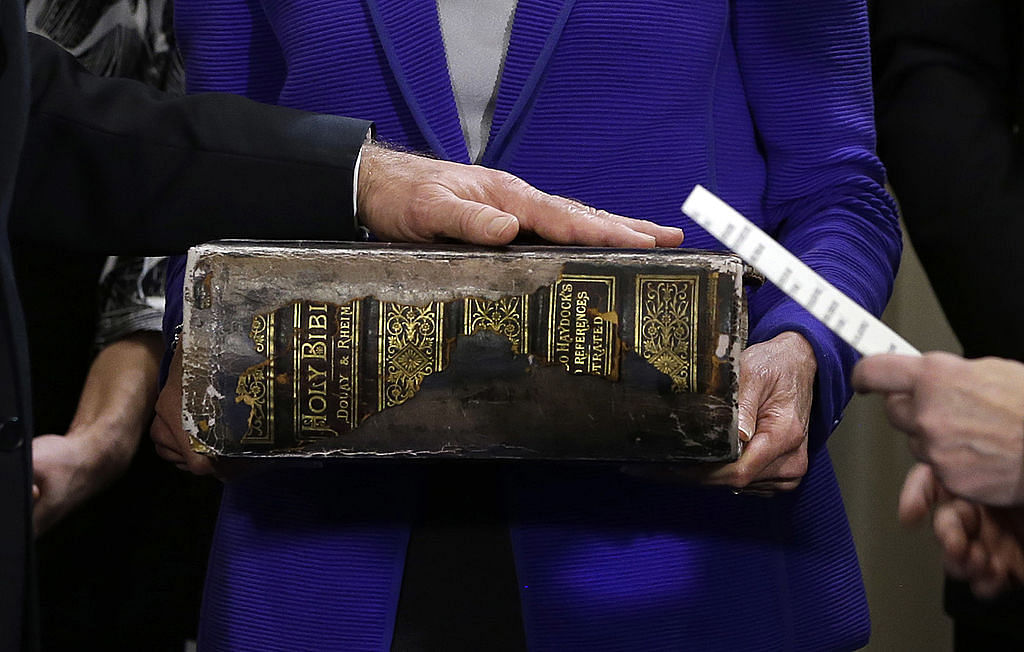  U.S. Vice President Joe Biden (L) places his hand on the Biden Family Bible as he takes the oath of office from U.S. Supreme Court Justice Sonia Sotomayor (R) as his wife Dr. Jill Biden holds the bibile during the official swearing-in ceremony at the Naval Observatory on January 20, 2013 in Washington, DC. Biden and U.S. President Barack Obama will be officially sworn in a day before the ceremonial inaugural swearing-in. Credit: Josh Haner-Pool/Getty Images