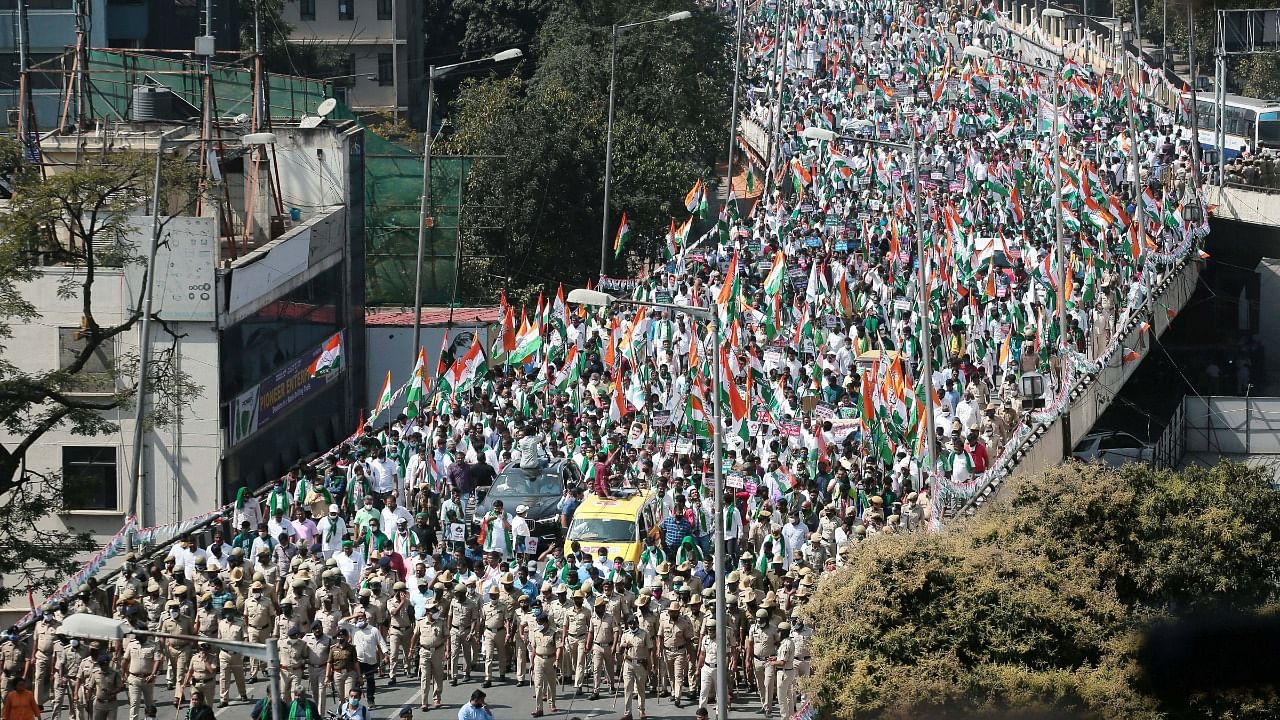 Congress party workers take out a rally 'Raj Bhavan Chalo' in support of farmers protesting against the new farm laws, in Bengaluru, Wednesday. Credit: PTI Photo