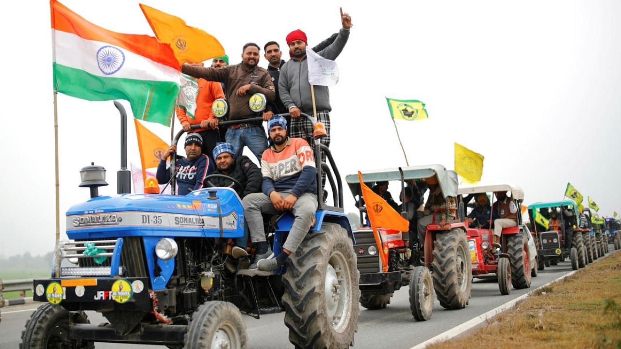 Farmers participate in a tractor rally to protest against the newly passed farm bills, on a highway on the outskirts of New Delhi. Credit: Reuters file photo.