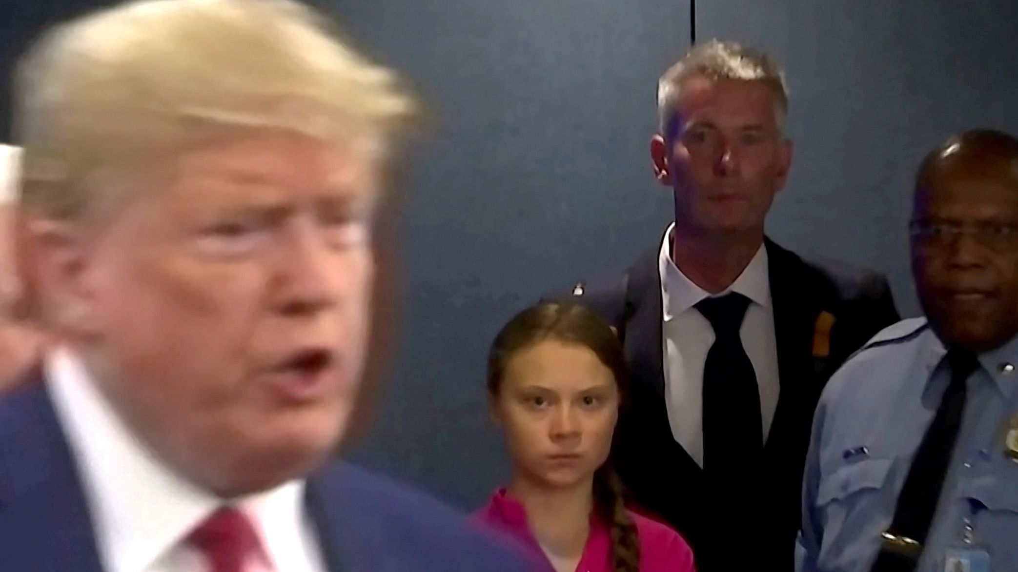 Swedish environmental activist Greta Thunberg watches as U.S. President Donald Trump enters the United Nations to speak with reporters in a still image from video taken in New York City, U.S. September 23, 2019. Credit: Reuters Photo